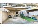 Townhome exterior with covered parking, grassy yard, and patriotic decor at 4846 Twin Lakes Trl, Atlanta, GA 30360