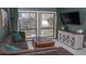 Cozy living room with a comfortable sectional sofa, entertainment center, and large windows providing natural light at 4846 Twin Lakes Trl, Atlanta, GA 30360