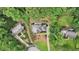 An aerial view captures this home nestled among lush trees, showcasing its secluded location at 5276 Beechwood Ct, Marietta, GA 30068