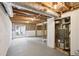 Unfinished basement featuring walkout access and exposed ductwork and framing at 5276 Beechwood Ct, Marietta, GA 30068