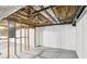 Unfinished basement featuring exposed utilities, framed walls, and concrete flooring at 5276 Beechwood Ct, Marietta, GA 30068