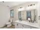 Modern bathroom with double sink vanity, sleek fixtures, and a large mirror at 5276 Beechwood Ct, Marietta, GA 30068