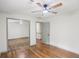 Bedroom with hardwood floors, closet with mirrored doors and a doorway to another room at 5276 Beechwood Ct, Marietta, GA 30068