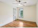 Bright bedroom with hardwood floors, a ceiling fan and a window with a view of the yard at 5276 Beechwood Ct, Marietta, GA 30068