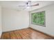 Bedroom with hardwood floors, one window with a view of the backyard and natural light at 5276 Beechwood Ct, Marietta, GA 30068