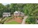 A charming home with an expansive front yard and tree-lined driveway creates a welcoming atmosphere at 5276 Beechwood Ct, Marietta, GA 30068