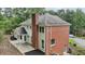 A luxurious house with a brick chimney, stone terrace, and a beautiful blend of brick and siding at 5276 Beechwood Ct, Marietta, GA 30068