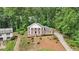 Majestic brick home featuring prominent white columns, set on a neatly landscaped front yard at 5276 Beechwood Ct, Marietta, GA 30068