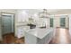 Modern kitchen features white cabinets, granite countertops, and stainless appliances at 5276 Beechwood Ct, Marietta, GA 30068