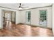 Bright, open-concept living space with hardwood floors and large windows at 5276 Beechwood Ct, Marietta, GA 30068