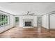 Elegant living room with a fireplace, hardwood floors and natural light at 5276 Beechwood Ct, Marietta, GA 30068