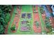 An aerial view highlights the garden, showing the manicured lawn and trimmed hedges at 1178 Chambord Ne Way, Brookhaven, GA 30319