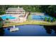 Aerial view of the community pool, lakefront dock, and tennis courts at 1178 Chambord Ne Way, Brookhaven, GA 30319