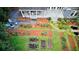 Stunning aerial view showcasing a landscaped yard with a patio, garden beds, and a charming water feature at 1178 Chambord Ne Way, Brookhaven, GA 30319