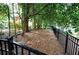 Wooded backyard with mature trees and a classic iron fence creating privacy for outdoor enjoyment at 1178 Chambord Ne Way, Brookhaven, GA 30319
