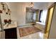 Spacious bathroom with dual vanity, glass shower, freestanding tub, and ornate chandelier at 1178 Chambord Ne Way, Brookhaven, GA 30319