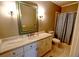 Bathroom with a vanity, large mirror and a shower with a curtain at 1178 Chambord Ne Way, Brookhaven, GA 30319