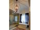 Elegant bathroom featuring a freestanding tub, glass shower, and decorative chandelier at 1178 Chambord Ne Way, Brookhaven, GA 30319