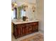 Elegant bathroom with a double vanity and a large framed mirror and sconces at 1178 Chambord Ne Way, Brookhaven, GA 30319
