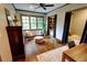 Bedroom showcasing natural light, stylish seating, wood floors and a bonus built-in sleeping nook at 1178 Chambord Ne Way, Brookhaven, GA 30319