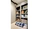 Bedroom nook featuring built-in bookshelves and soft, cozy bedding at 1178 Chambord Ne Way, Brookhaven, GA 30319