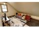 Bonus room with large rug, sofa and accent pillows plus hardwood trim at 1178 Chambord Ne Way, Brookhaven, GA 30319