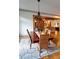 Light-filled dining room boasts hardwood floors, stylish chandelier, and comfortable seating at 1178 Chambord Ne Way, Brookhaven, GA 30319