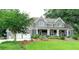 Beautiful exterior featuring manicured lawn, mature trees, and a painted brick home with a large garage at 1178 Chambord Ne Way, Brookhaven, GA 30319