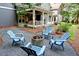 Cozy backyard firepit with Adirondack chairs offers an inviting outdoor space for relaxation and entertaining in a private setting at 1178 Chambord Ne Way, Brookhaven, GA 30319