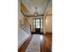 Entryway showcases hardwood floors, a staircase, and a front door with sidelights at 1178 Chambord Ne Way, Brookhaven, GA 30319