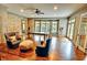 Open game room featuring hardwood floors, natural light, and large comfortable seating at 1178 Chambord Ne Way, Brookhaven, GA 30319