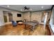 Spacious game room with brick accent wall, comfortable seating, and stylish decor at 1178 Chambord Ne Way, Brookhaven, GA 30319