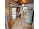 Hallway with brick floors, view to dining and living areas, complemented by a charming desk setup at 1178 Chambord Ne Way, Brookhaven, GA 30319