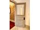 Hallway with striking patterned wallpaper and wood flooring at 1178 Chambord Ne Way, Brookhaven, GA 30319