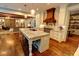 Gourmet kitchen with custom cabinets, marble counters, oversized island with seating and is open to the living room at 1178 Chambord Ne Way, Brookhaven, GA 30319