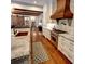 Bright kitchen features marble countertops, copper accents, and stainless steel appliances at 1178 Chambord Ne Way, Brookhaven, GA 30319