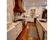 Spacious kitchen with custom cabinets, marble counters, and professional-grade stainless steel appliances at 1178 Chambord Ne Way, Brookhaven, GA 30319
