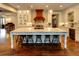 Gourmet kitchen with custom cabinets, marble counters, oversized island with seating, and stainless steel appliances at 1178 Chambord Ne Way, Brookhaven, GA 30319