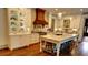Gourmet kitchen features custom cabinetry, marble countertops, large island, and stainless steel appliances at 1178 Chambord Ne Way, Brookhaven, GA 30319