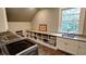 Laundry room with shelving and window to let natural light at 1178 Chambord Ne Way, Brookhaven, GA 30319