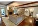 Bright living room featuring hardwood floors, fireplace, sliding barn doors, and comfortable seating at 1178 Chambord Ne Way, Brookhaven, GA 30319