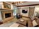 Comfortable living room with fireplace, barn doors, mounted tv, and stylish decor at 1178 Chambord Ne Way, Brookhaven, GA 30319