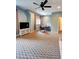 Open concept living room features neutral color scheme with television and table and chairs at 1178 Chambord Ne Way, Brookhaven, GA 30319