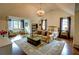 Bedroom suite featuring sitting area, decorative rug, chandelier, and built in shelving at 1178 Chambord Ne Way, Brookhaven, GA 30319