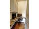 This is a functional office nook featuring a built-in desk, ample cabinet space, and hardwood floors at 1178 Chambord Ne Way, Brookhaven, GA 30319