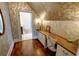 Cozy office space with built-in desk, hardwood floors, and stylish wallpaper at 1178 Chambord Ne Way, Brookhaven, GA 30319