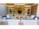 Beautiful outdoor living space with a stone fireplace, comfortable seating, and elegant design at 1178 Chambord Ne Way, Brookhaven, GA 30319