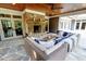 Stylish outdoor living area with a stone fireplace, comfortable seating, and a serene backyard view at 1178 Chambord Ne Way, Brookhaven, GA 30319