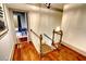 Stairway with hardwood flooring and decorative railings, leading to a room with views of the bedroom at 1178 Chambord Ne Way, Brookhaven, GA 30319