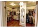 Walk-in closet provides ample storage for clothing and accessories; natural light from the hallway at 1178 Chambord Ne Way, Brookhaven, GA 30319